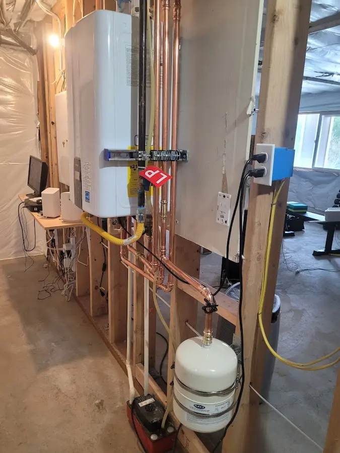 Licensed plumber repairing a kitchen sink in Beacon